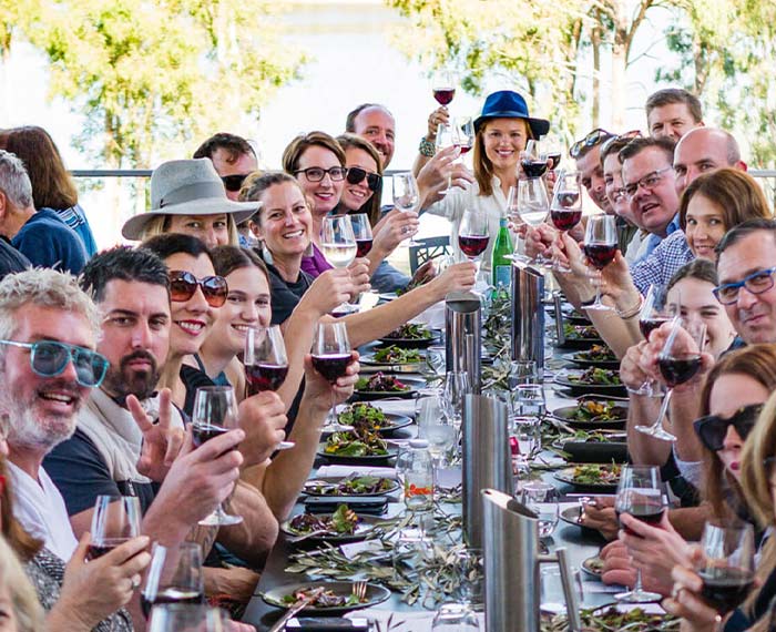 Image of diners at long lunch