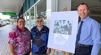 Robin and Roslyn Yuke with Cr Michael Enright and Petersen Street Children panel.