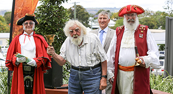 Town Crier and Assistant Town Crier with retired Town Crier and Mayor.