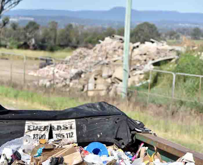 Image of waste against backdrop of natural environment